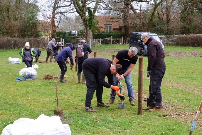 Mountain bikers planting trees