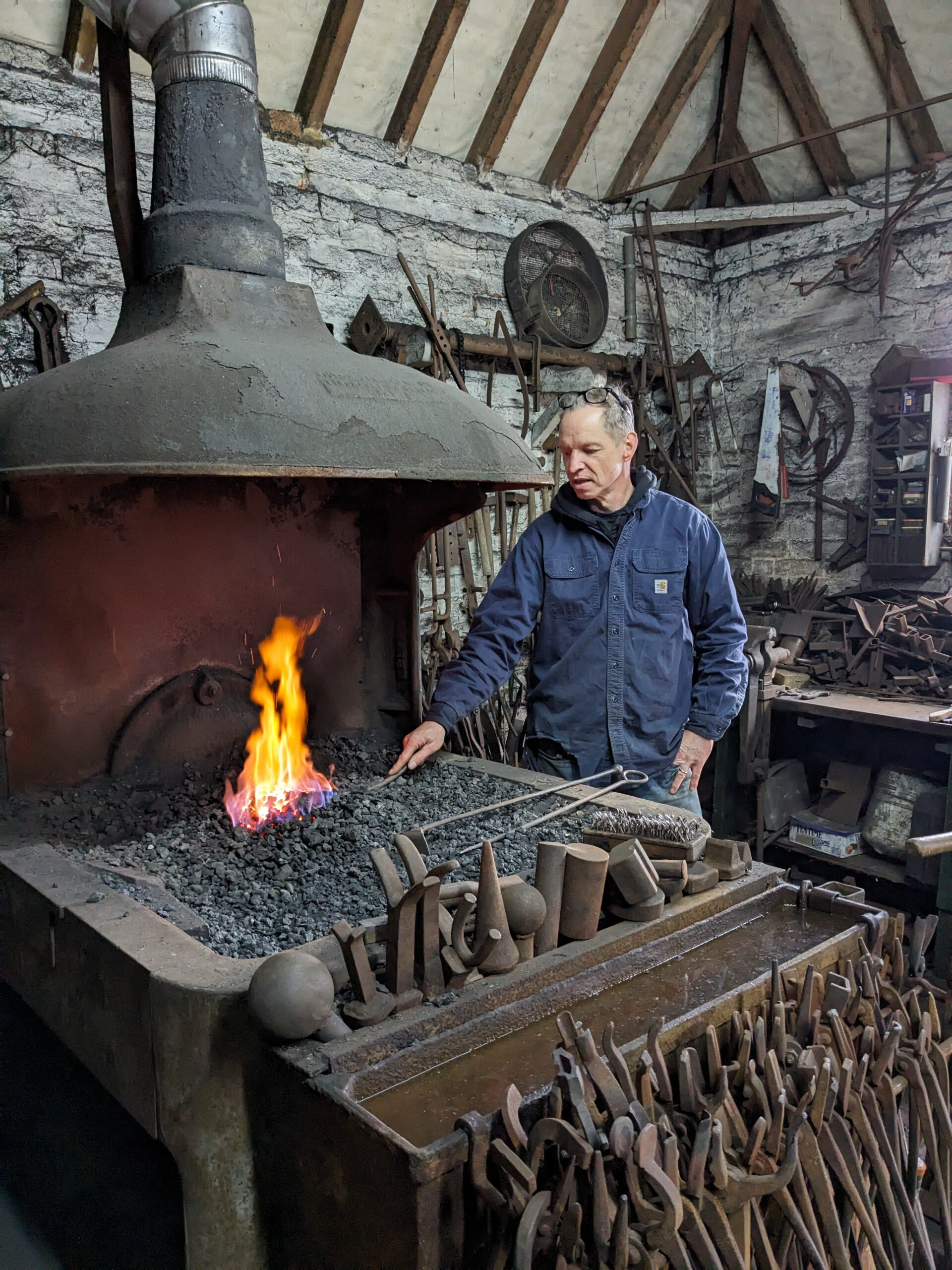 Blacksmith working in forge