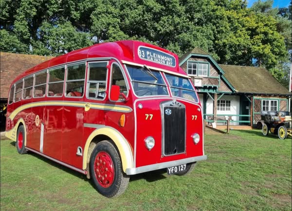 Red bus on museum lawn