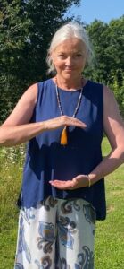 Surrey Hills QIgong instructor Sue, holding an 'energy ball in front of her
