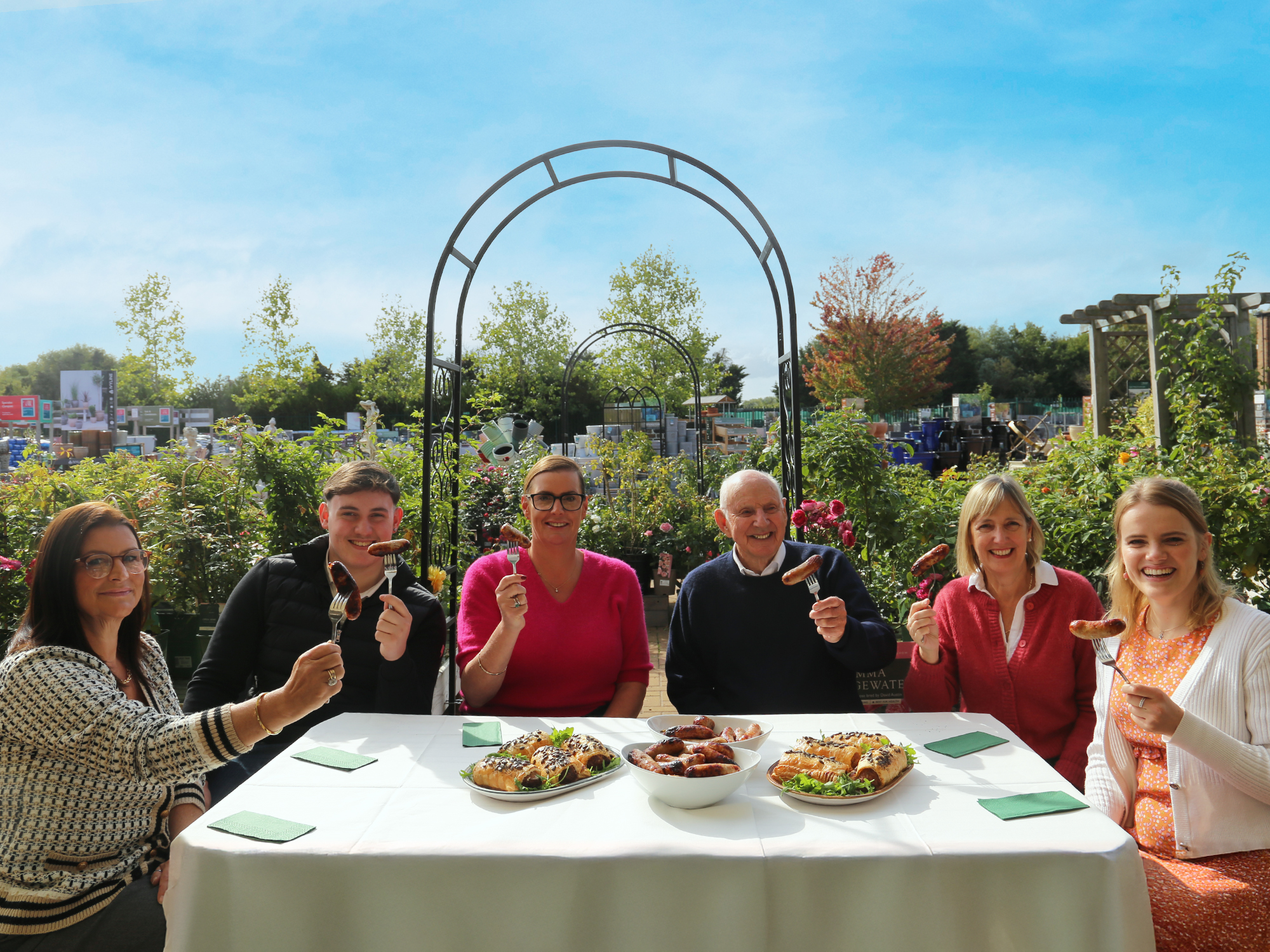 Fresh flavours, local ingredients and warming seasonal dishes: three members of the White family (from centre to left: Porky White’s Managing Director, Francesca Wyatt, Will Wyatt (Fran’s son) and Alix White (Fran’s sister), joined Colin Squire, his daughter, Sarah and granddaughter, Felicia Baily. The families ‘toasted in’ the  award-winning Porky Whites Surrey Sausage, which joins the new season menu.