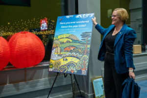 MP for Guildford Zoe Franklin unveiling the Surrey Hills 2100 Vision artwork